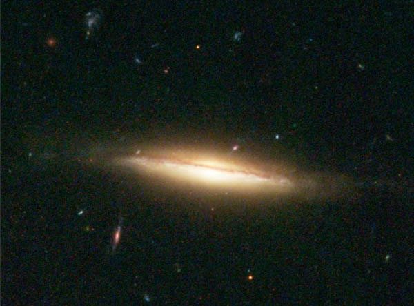 NGC3370-Warped-Spiral-Galaxy-Edge-On_HST2003_NASA-The-Hubble-Heritage-Team_A-Riess(STScI)_hs-2003-24_600w