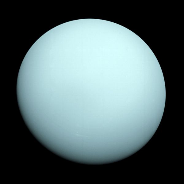 Uranus as a virtually featureless planet in visible light as imaged by the Voyager 2 interplanetary mission spacecraft fly-by in 1986