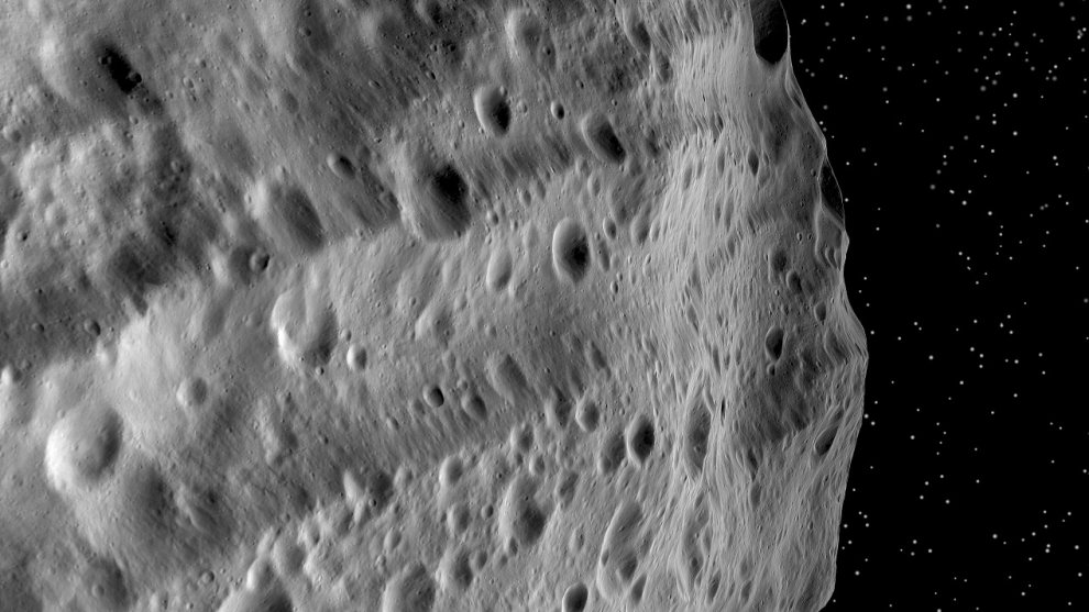 asteroids_44_4Vista_close-view-artificial-projected-mosiac_DawnJan&Apr2012_NASA,JPL_Divalia_Fossa_PIA15673_990w